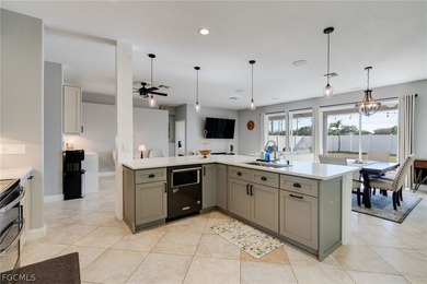 Beautifully updated single-family home located in the gated on Gateway Golf and Country Club in Florida - for sale on GolfHomes.com, golf home, golf lot