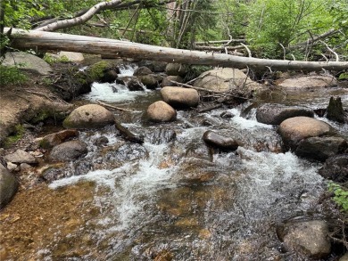 Discover the beauty and seclusion of Lot 59, a rare opportunity on The River Course At Keystone in Colorado - for sale on GolfHomes.com, golf home, golf lot