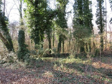 This 4 bedroom, 3 bath ranch has perfect bones and a great floor on Cherokee Golf and Country Club in Georgia - for sale on GolfHomes.com, golf home, golf lot