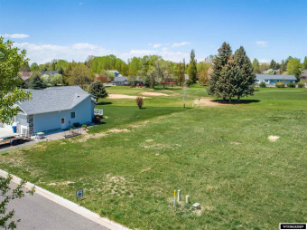 Adjacent to #7 fairway.  Buyer must complete sidewalk.  Various on Riverton Country Club in Wyoming - for sale on GolfHomes.com, golf home, golf lot