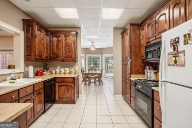 STUNNING BRICK HOME beautifully maintained and nestled on 2.65 on The Orchard Golf and Country Club in Georgia - for sale on GolfHomes.com, golf home, golf lot