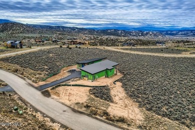 This exquisite residence offers unparalleled luxury and on Eagle Ranch in Colorado - for sale on GolfHomes.com, golf home, golf lot