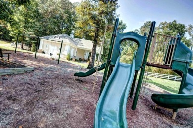 Set against a serene, park-like backdrop with a long view of the on The Tradition Golf Club At Stonehouse in Virginia - for sale on GolfHomes.com, golf home, golf lot