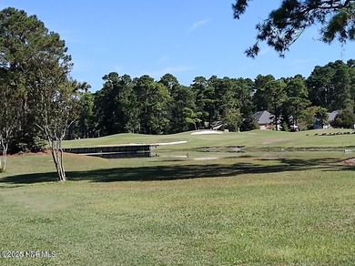 Wooded parcel with varied view of Northwest Creek. Located in on Harbour Point Golf Club in North Carolina - for sale on GolfHomes.com, golf home, golf lot