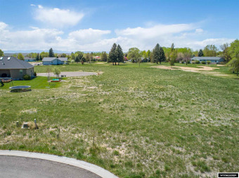 This lot is along #7 fairway.  Buyer must complete sidewalk on Riverton Country Club in Wyoming - for sale on GolfHomes.com, golf home, golf lot