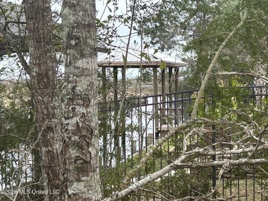 Beautiful waterfront lot offering stunning views and deep-water on Diamondhead Country Club in Mississippi - for sale on GolfHomes.com, golf home, golf lot