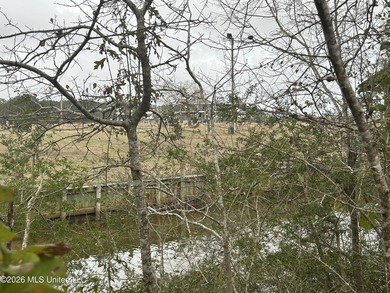 Beautiful waterfront lot offering stunning views and deep-water on Diamondhead Country Club in Mississippi - for sale on GolfHomes.com, golf home, golf lot