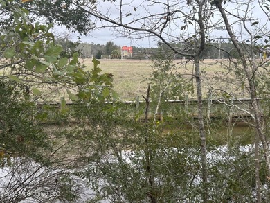 Beautiful waterfront lot offering stunning views and deep-water on Diamondhead Country Club in Mississippi - for sale on GolfHomes.com, golf home, golf lot