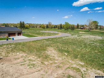 Located by #4 fairway.  Buyer must complete sidewalk.  Various on Riverton Country Club in Wyoming - for sale on GolfHomes.com, golf home, golf lot