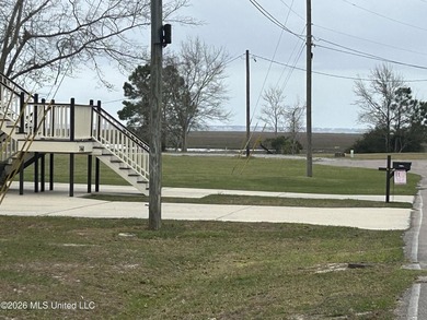 Beautiful waterfront lot offering stunning views and deep-water on Diamondhead Country Club in Mississippi - for sale on GolfHomes.com, golf home, golf lot