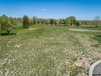 Beside the 7th fairway.  Buyer must complete sidewalk.  Various on Riverton Country Club in Wyoming - for sale on GolfHomes.com, golf home, golf lot