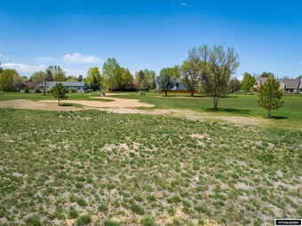 Beside the 7th fairway.  Buyer must complete sidewalk.  Various on Riverton Country Club in Wyoming - for sale on GolfHomes.com, golf home, golf lot