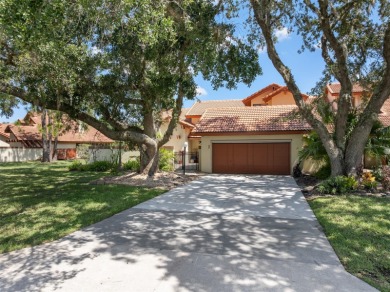 This exceptional end-unit townhome is strategically located on on The Grand Club - Pine Lakes Course in Florida - for sale on GolfHomes.com, golf home, golf lot