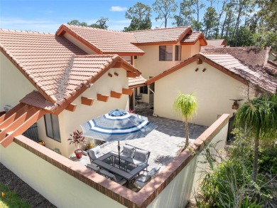 This exceptional end-unit townhome is strategically located on on The Grand Club - Pine Lakes Course in Florida - for sale on GolfHomes.com, golf home, golf lot