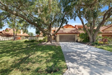 This exceptional end-unit townhome is strategically located on on The Grand Club - Pine Lakes Course in Florida - for sale on GolfHomes.com, golf home, golf lot