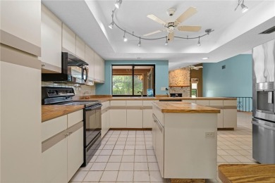 SPACIOUS POOL HOME OVERLOOKING GOLF COURSE IN LAKE SUZY on Kingsway Country Club in Florida - for sale on GolfHomes.com, golf home, golf lot