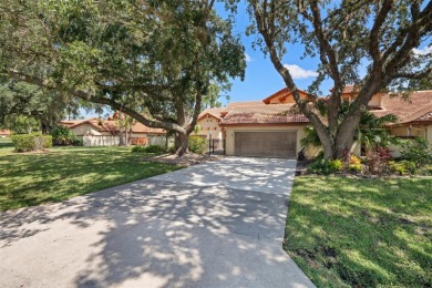 This exceptional end-unit townhome is strategically located on on The Grand Club - Pine Lakes Course in Florida - for sale on GolfHomes.com, golf home, golf lot