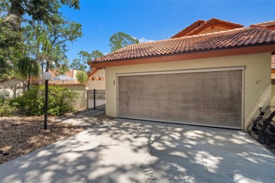 This exceptional end-unit townhome is strategically located on on The Grand Club - Pine Lakes Course in Florida - for sale on GolfHomes.com, golf home, golf lot