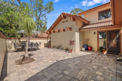 This exceptional end-unit townhome is strategically located on on The Grand Club - Pine Lakes Course in Florida - for sale on GolfHomes.com, golf home, golf lot