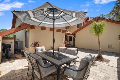 This exceptional end-unit townhome is strategically located on on The Grand Club - Pine Lakes Course in Florida - for sale on GolfHomes.com, golf home, golf lot