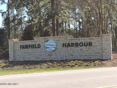 Wooded lot across the street from waterfront property on on Harbour Point Golf Club in North Carolina - for sale on GolfHomes.com, golf home, golf lot