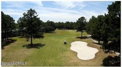 Wooded lot across the street from waterfront property on on Harbour Point Golf Club in North Carolina - for sale on GolfHomes.com, golf home, golf lot