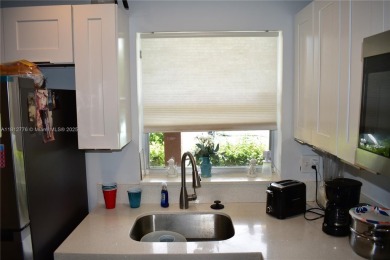Nice, first floor 1 bedroom apartment with renovated kitchen on Sunrise Lakes Phase III in Florida - for sale on GolfHomes.com, golf home, golf lot