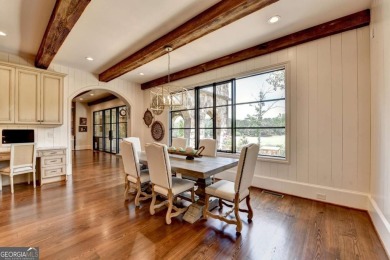 Experience unparalleled elegance in this luxury LAKEFRONT estate on The River Club in Georgia - for sale on GolfHomes.com, golf home, golf lot