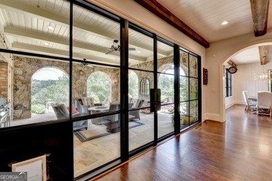 Experience unparalleled elegance in this luxury LAKEFRONT estate on The River Club in Georgia - for sale on GolfHomes.com, golf home, golf lot