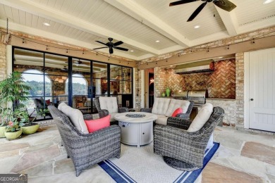 Experience unparalleled elegance in this luxury LAKEFRONT estate on The River Club in Georgia - for sale on GolfHomes.com, golf home, golf lot