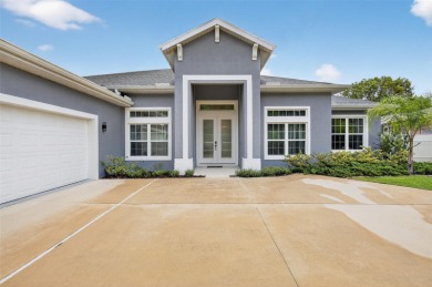 Experience the best of modern Florida living in this custom on Palm Harbor Golf Club in Florida - for sale on GolfHomes.com, golf home, golf lot