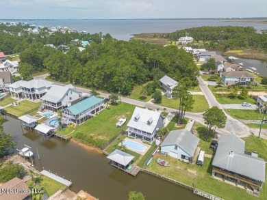 Welcome to your dream home on the water, where every detail has on Pass Christian Isles Golf Club in Mississippi - for sale on GolfHomes.com, golf home, golf lot