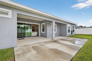 Experience the best of modern Florida living in this custom on Palm Harbor Golf Club in Florida - for sale on GolfHomes.com, golf home, golf lot