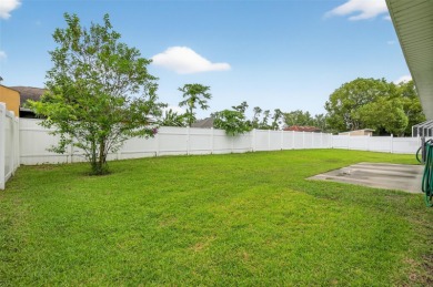 Experience the best of modern Florida living in this custom on Palm Harbor Golf Club in Florida - for sale on GolfHomes.com, golf home, golf lot