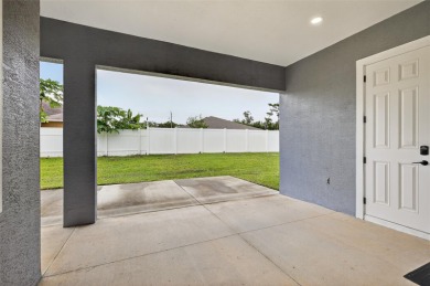 Experience the best of modern Florida living in this custom on Palm Harbor Golf Club in Florida - for sale on GolfHomes.com, golf home, golf lot