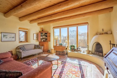 Charming Adobe Pumice Home with Expansive Mountain Views on Taos Country Club in New Mexico - for sale on GolfHomes.com, golf home, golf lot