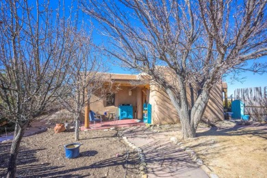 Charming Adobe Pumice Home with Expansive Mountain Views on Taos Country Club in New Mexico - for sale on GolfHomes.com, golf home, golf lot