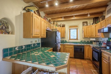 Charming Adobe Pumice Home with Expansive Mountain Views on Taos Country Club in New Mexico - for sale on GolfHomes.com, golf home, golf lot