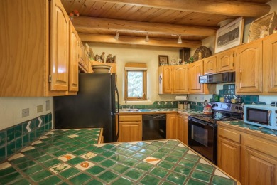 Charming Adobe Pumice Home with Expansive Mountain Views on Taos Country Club in New Mexico - for sale on GolfHomes.com, golf home, golf lot