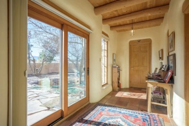 Charming Adobe Pumice Home with Expansive Mountain Views on Taos Country Club in New Mexico - for sale on GolfHomes.com, golf home, golf lot