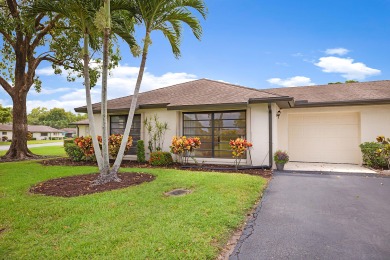 Beautifully remodeled 2/2 villae see this light and bright villa on Pine Tree Golf Club in Florida - for sale on GolfHomes.com, golf home, golf lot