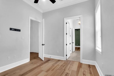 Discover a home that truly has it all! This stunning 3-bedroom on University Club in Louisiana - for sale on GolfHomes.com, golf home, golf lot