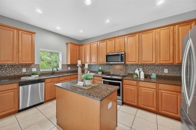 SCENIC. SPACIOUS. SERENEe visit this 4-bedroom, 2.5-bath home on on Meadow Oaks Golf and Country Club in Florida - for sale on GolfHomes.com, golf home, golf lot