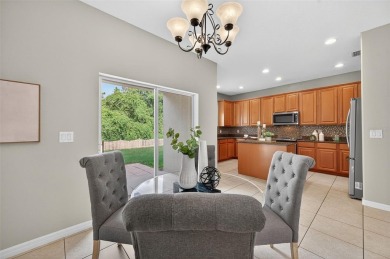 SCENIC. SPACIOUS. SERENEe visit this 4-bedroom, 2.5-bath home on on Meadow Oaks Golf and Country Club in Florida - for sale on GolfHomes.com, golf home, golf lot