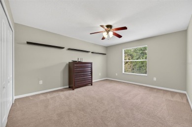 SCENIC. SPACIOUS. SERENEe visit this 4-bedroom, 2.5-bath home on on Meadow Oaks Golf and Country Club in Florida - for sale on GolfHomes.com, golf home, golf lot