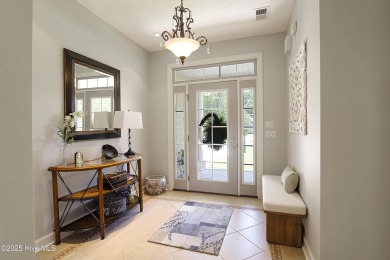 Tucked away on a quiet cul-de-sac in the prestigious gated golf on Brunswick Plantation and Golf Resorts in North Carolina - for sale on GolfHomes.com, golf home, golf lot