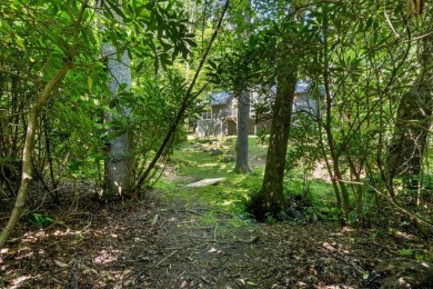 Located in the heart of Sapphire Valley, this well-maintained on Sapphire National Golf Club in North Carolina - for sale on GolfHomes.com, golf home, golf lot