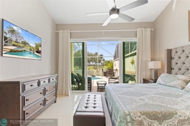 Very rarely available corner villa overlooking a canal and the on Palm-Aire Country Club and Resort - The Oaks in Florida - for sale on GolfHomes.com, golf home, golf lot