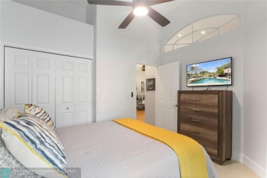 Very rarely available corner villa overlooking a canal and the on Palm-Aire Country Club and Resort - The Oaks in Florida - for sale on GolfHomes.com, golf home, golf lot