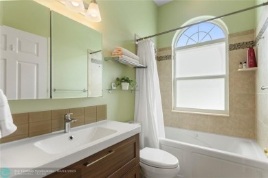 Very rarely available corner villa overlooking a canal and the on Palm-Aire Country Club and Resort - The Oaks in Florida - for sale on GolfHomes.com, golf home, golf lot